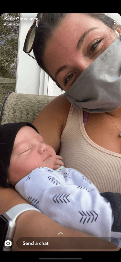 Aunt wearing mask for newborn in pandemic
